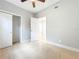 Bedroom with tile floors and standard closet with double doors at 6408 Ridge Ter, Orlando, FL 32810