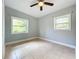 Bedroom featuring two windows providing natural light at 6408 Ridge Ter, Orlando, FL 32810