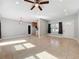 Open living space featuring tile floors, recessed lighting, and a ceiling fan, flowing into the kitchen area at 6408 Ridge Ter, Orlando, FL 32810