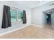 Bright and airy living area with tile floors, leading to the front door and hallway, with modern decor at 6408 Ridge Ter, Orlando, FL 32810