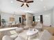 Open living and dining area with tile flooring, featuring modern furniture and ample natural light at 6408 Ridge Ter, Orlando, FL 32810