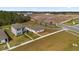 Community aerial view showcasing new home construction and neighborhood design near recreational areas, promoting Gathering-friendly living at 6895 Botanic Blvd, Harmony, FL 34773