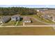 New home construction aerial view showing modern homes, spacious lawns, and planned community layout in a desirable location at 6895 Botanic Blvd, Harmony, FL 34773