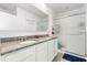 Clean bathroom features a double vanity with granite countertops and a glass-enclosed shower at 6895 Botanic Blvd, Harmony, FL 34773