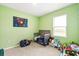 Adorable Bedroom features a crib, comfy seating, and storage for toys and books at 6895 Botanic Blvd, Harmony, FL 34773
