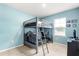Charming bedroom features a bunk bed and a window for natural lighting at 6895 Botanic Blvd, Harmony, FL 34773