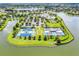 Beautiful aerial shot showcasing tennis courts and stunning lake views within this community at 8456 Norwich Way, Mount Dora, FL 32757