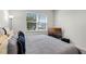 Inviting bedroom with a window and television, creating a relaxing retreat at 8456 Norwich Way, Mount Dora, FL 32757