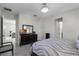 Bedroom with neutral tones, ensuite bathroom access, and accent furniture at 8456 Norwich Way, Mount Dora, FL 32757