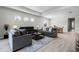 Spacious living area with comfortable seating, recessed lighting, and dining area view at 8456 Norwich Way, Mount Dora, FL 32757