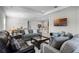 Open-concept living room with tile floors, recessed lighting, and a view into the kitchen at 8456 Norwich Way, Mount Dora, FL 32757