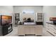 Home office featuring custom desk, built-in shelving, and natural light from a window at 8456 Norwich Way, Mount Dora, FL 32757