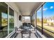 Relaxing screened patio with comfortable seating and a view of the backyard at 8456 Norwich Way, Mount Dora, FL 32757