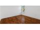 Bedroom with hardwood floors and large window offering natural light at 9026 Paolos Pl, Kissimmee, FL 34747