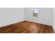Bedroom featuring hardwood floors and a window with natural light at 9026 Paolos Pl, Kissimmee, FL 34747