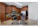 Well-equipped kitchen featuring granite countertops, stainless steel appliances, and tile backsplash at 9026 Paolos Pl, Kissimmee, FL 34747