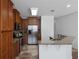 Stylish kitchen featuring stainless steel appliances, granite counters, and a breakfast bar at 9026 Paolos Pl, Kissimmee, FL 34747