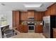 Well-equipped kitchen with stainless steel appliances, granite countertops, and tile backsplash at 9026 Paolos Pl, Kissimmee, FL 34747