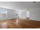Bright living room with hardwood floors and large windows offering plenty of natural light at 9026 Paolos Pl, Kissimmee, FL 34747