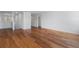 Large living room with wood flooring, white walls, and plenty of natural light at 9026 Paolos Pl, Kissimmee, FL 34747