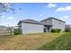 Spacious backyard with well-maintained lawn, patio, and privacy fencing at 9862 Pecan Hickory Way, Orlando, FL 32832