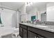 Bathroom featuring dual sinks, granite countertops, and a shower-tub combination at 9862 Pecan Hickory Way, Orlando, FL 32832