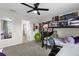 Shared bedroom featuring a bunk bed, a desk, and a ceiling fan at 9862 Pecan Hickory Way, Orlando, FL 32832