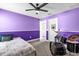 Colorful bedroom featuring a drum set, ceiling fan, and closet at 9862 Pecan Hickory Way, Orlando, FL 32832