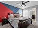 Bedroom with a queen-sized bed and a en-suite bathroom at 9862 Pecan Hickory Way, Orlando, FL 32832