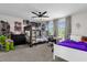 Shared bedroom featuring a bunk bed, a white bed, a desk, and a ceiling fan at 9862 Pecan Hickory Way, Orlando, FL 32832
