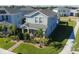 Aerial view of a two-story home with well-maintained landscaping in a residential neighborhood at 9862 Pecan Hickory Way, Orlando, FL 32832