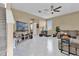 Spacious living area with bright, patterned floors, ceiling fan, and natural light at 9862 Pecan Hickory Way, Orlando, FL 32832
