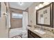 Bright bathroom featuring a shower-tub combo, granite countertop vanity, and nautical decor at 1017 Bluejack Oak Dr, Oviedo, FL 32765