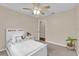 Cozy bedroom with a ceiling fan, natural light, and neutral-toned walls at 1017 Bluejack Oak Dr, Oviedo, FL 32765