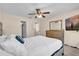 Serene bedroom featuring a comfortable bed, wooden dresser, and a ceiling fan at 1017 Bluejack Oak Dr, Oviedo, FL 32765