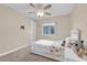 Bright bedroom with a ceiling fan, window view, and charming decor at 1017 Bluejack Oak Dr, Oviedo, FL 32765