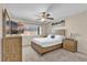 Bedroom featuring natural-tone furniture, a ceiling fan, and ample sunlight at 1017 Bluejack Oak Dr, Oviedo, FL 32765