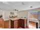 Bright dining area with wood floors, granite countertops, and a large window at 1017 Bluejack Oak Dr, Oviedo, FL 32765