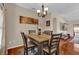 Formal dining room featuring a stylish table, seating for four, and decorative artwork at 1017 Bluejack Oak Dr, Oviedo, FL 32765