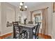 Elegant dining room with wood floors, a chandelier, and seating for four at 1017 Bluejack Oak Dr, Oviedo, FL 32765