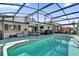 Backyard pool and outdoor living space in screened-in patio enclosure at 1017 Bluejack Oak Dr, Oviedo, FL 32765