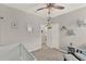 This Bedroom boasts neutral walls with a white crib and a comfortable rocking chair at 10319 Austrina Oak Loop, Winter Garden, FL 34787