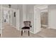 Hallway features gray walls and multiple doors leading to the various rooms at 10319 Austrina Oak Loop, Winter Garden, FL 34787