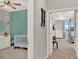 Hallway view with a glimpse into the Bedroom and Primary bedroom, showcasing the home's layout at 10319 Austrina Oak Loop, Winter Garden, FL 34787