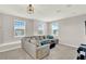 Upstairs living room is light and airy thanks to the multiple windows at 10319 Austrina Oak Loop, Winter Garden, FL 34787