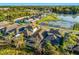 An aerial view showcases this community's beautiful homes, water features, and convenient neighborhood layout at 1208 Patterson Ter, Lake Mary, FL 32746