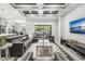 Comfortable living room featuring a large sofa, modern decor, and an open layout to the kitchen at 1208 Patterson Ter, Lake Mary, FL 32746