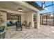 Inviting outdoor patio features a covered area with seating and a view of the screened pool at 1208 Patterson Ter, Lake Mary, FL 32746