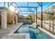 Beautiful screened pool with relaxing water feature and stone surround, perfect for enjoying the outdoors at 1208 Patterson Ter, Lake Mary, FL 32746