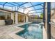 A backyard pool is surrounded by a screened-in patio, with furniture for lounging at 1208 Patterson Ter, Lake Mary, FL 32746